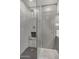 Clean shower with modern gray tile and a glass enclosure at 103 E Palm Ln # A, Phoenix, AZ 85004