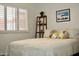 Well-lit bedroom featuring a double bed and window with shutters at 103 E Palm Ln # A, Phoenix, AZ 85004