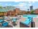 Relaxing pool area with patio furniture and BBQ at 103 E Palm Ln # A, Phoenix, AZ 85004
