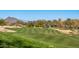 Scenic golf course with rolling greens and mountain backdrop at 27789 N 129Th Ln, Peoria, AZ 85383