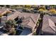 Aerial view of single-story house with tile roof and two-car garage at 27789 N 129Th Ln, Peoria, AZ 85383