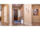 Bright and spacious entryway with tile flooring and a view into the living areas at 27789 N 129Th Ln, Peoria, AZ 85383