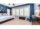 Main bedroom with a king-size bed and bay window with plantation shutters at 27789 N 129Th Ln, Peoria, AZ 85383