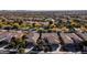Aerial view of house in a community with surrounding houses and landscape at 27789 N 129Th Ln, Peoria, AZ 85383