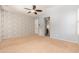 Primary bedroom with walk-in closet and neutral decor at 27789 N 129Th Ln, Peoria, AZ 85383