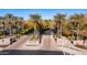 Entrance to Kiva Club and Athletic Club with palm trees at 27789 N 129Th Ln, Peoria, AZ 85383