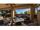 Covered patio with comfortable seating and fire pit at 27789 N 129Th Ln, Peoria, AZ 85383