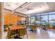Community room with tables, chairs, and large windows at 27789 N 129Th Ln, Peoria, AZ 85383