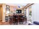 Home bar with dark wood cabinets and seating for four at 27789 N 129Th Ln, Peoria, AZ 85383