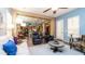 Bright living room with comfortable seating and views into the kitchen at 27789 N 129Th Ln, Peoria, AZ 85383