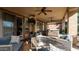 Relaxing covered patio with seating area, hot tub, and fire pit at 27789 N 129Th Ln, Peoria, AZ 85383