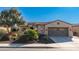 Front view of single story home with two car garage at 27789 N 129Th Ln, Peoria, AZ 85383