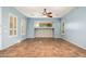 Light and airy living room with tile floors and ceiling fan at 27789 N 129Th Ln, Peoria, AZ 85383