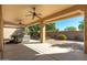 Covered patio with hot tub and ceiling fans at 27789 N 129Th Ln, Peoria, AZ 85383
