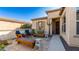 Charming front patio with stone flooring and wooden seating at 27789 N 129Th Ln, Peoria, AZ 85383