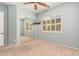 Bedroom with mirrored closet doors, ceiling fan and window shutters at 27789 N 129Th Ln, Peoria, AZ 85383