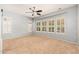Bright bedroom with neutral carpeting and bay window with shutters at 27789 N 129Th Ln, Peoria, AZ 85383