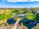 Picturesque bridge over a tranquil lake with palm trees at 27789 N 129Th Ln, Peoria, AZ 85383