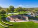 Community playground with play structures and basketball courts at 27789 N 129Th Ln, Peoria, AZ 85383