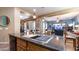 Kitchen island with sink, and stainless steel appliances at 27789 N 129Th Ln, Peoria, AZ 85383