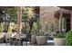 Relaxing patio area with tables, chairs, and umbrellas at 27789 N 129Th Ln, Peoria, AZ 85383