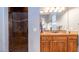 Elegant bathroom with wood vanity and large shower at 27789 N 129Th Ln, Peoria, AZ 85383