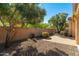 Landscaped backyard with a brick patio and gravel at 27789 N 129Th Ln, Peoria, AZ 85383