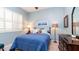 Bedroom with a full-size bed and window with plantation shutters at 27789 N 129Th Ln, Peoria, AZ 85383