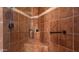 Large walk-in shower with tiled walls and built-in seat at 27789 N 129Th Ln, Peoria, AZ 85383