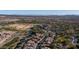 Aerial view of community with golf course, clubhouse, and pond at 27789 N 129Th Ln, Peoria, AZ 85383