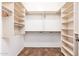 Large walk-in closet with ample shelving and hanging space at 27789 N 129Th Ln, Peoria, AZ 85383