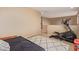 Bedroom with elliptical and daybed, near loft area at 10441 W Los Gatos Dr, Peoria, AZ 85383