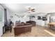 Living room with brown leather couches and a wood-look floor at 2132 W Glenrosa Ave # 81D, Phoenix, AZ 85015