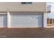 Attached garage with white sectional door at 2132 W Glenrosa Ave # 81D, Phoenix, AZ 85015