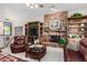 Cozy Gathering room with leather furniture and a brick fireplace at 2166 E Caroline Ln, Tempe, AZ 85284