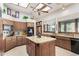 Island kitchen with granite countertops and wood cabinetry at 2166 E Caroline Ln, Tempe, AZ 85284
