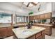 Kitchen features granite countertops, wood cabinets and island at 2166 E Caroline Ln, Tempe, AZ 85284