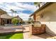 Built-in brick grill next to the pool and home; great for entertaining at 2166 E Caroline Ln, Tempe, AZ 85284