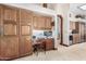 Kitchen features wood cabinetry, granite countertops and a built in desk at 2166 E Caroline Ln, Tempe, AZ 85284