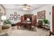 Spacious home office with a large desk, comfortable seating, and ample natural light at 2166 E Caroline Ln, Tempe, AZ 85284