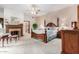Spacious primary bedroom with fireplace and large windows at 2166 E Caroline Ln, Tempe, AZ 85284