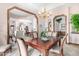 Bright dining room with a view of the living room and a chandelier at 2166 E Caroline Ln, Tempe, AZ 85284