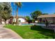 Landscaped backyard with a pool, basketball court and palm trees at 2166 E Caroline Ln, Tempe, AZ 85284