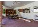 Covered patio with dining table and chairs, tile flooring, and ceiling fan at 2166 E Caroline Ln, Tempe, AZ 85284