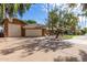 Brick house with attached garage and nicely landscaped yard at 2166 E Caroline Ln, Tempe, AZ 85284