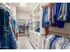 Large walk-in closet with ample shelving and hanging space at 2166 E Caroline Ln, Tempe, AZ 85284