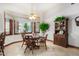 Bright breakfast nook with wood table and chairs, built in hutch at 2166 E Caroline Ln, Tempe, AZ 85284