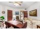 Home office with a large desk, comfortable seating, and built-in cabinetry at 2166 E Caroline Ln, Tempe, AZ 85284