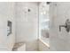 Large walk-in shower with tiled walls and bench seating at 2166 E Caroline Ln, Tempe, AZ 85284