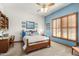 Charming bedroom with wood furniture and plantation shutters at 2166 E Caroline Ln, Tempe, AZ 85284